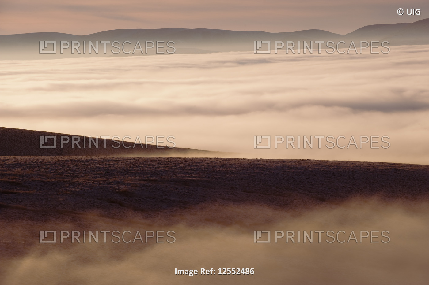 Sun setting over the Eden Valley shrouded in winter mist. Cumbria - England